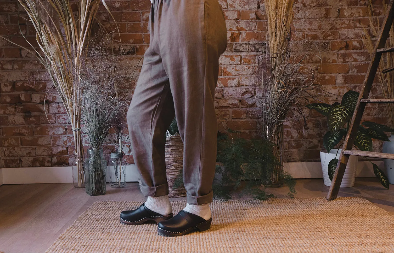 Stylish Black Clogs with Brown Base for Classic Look